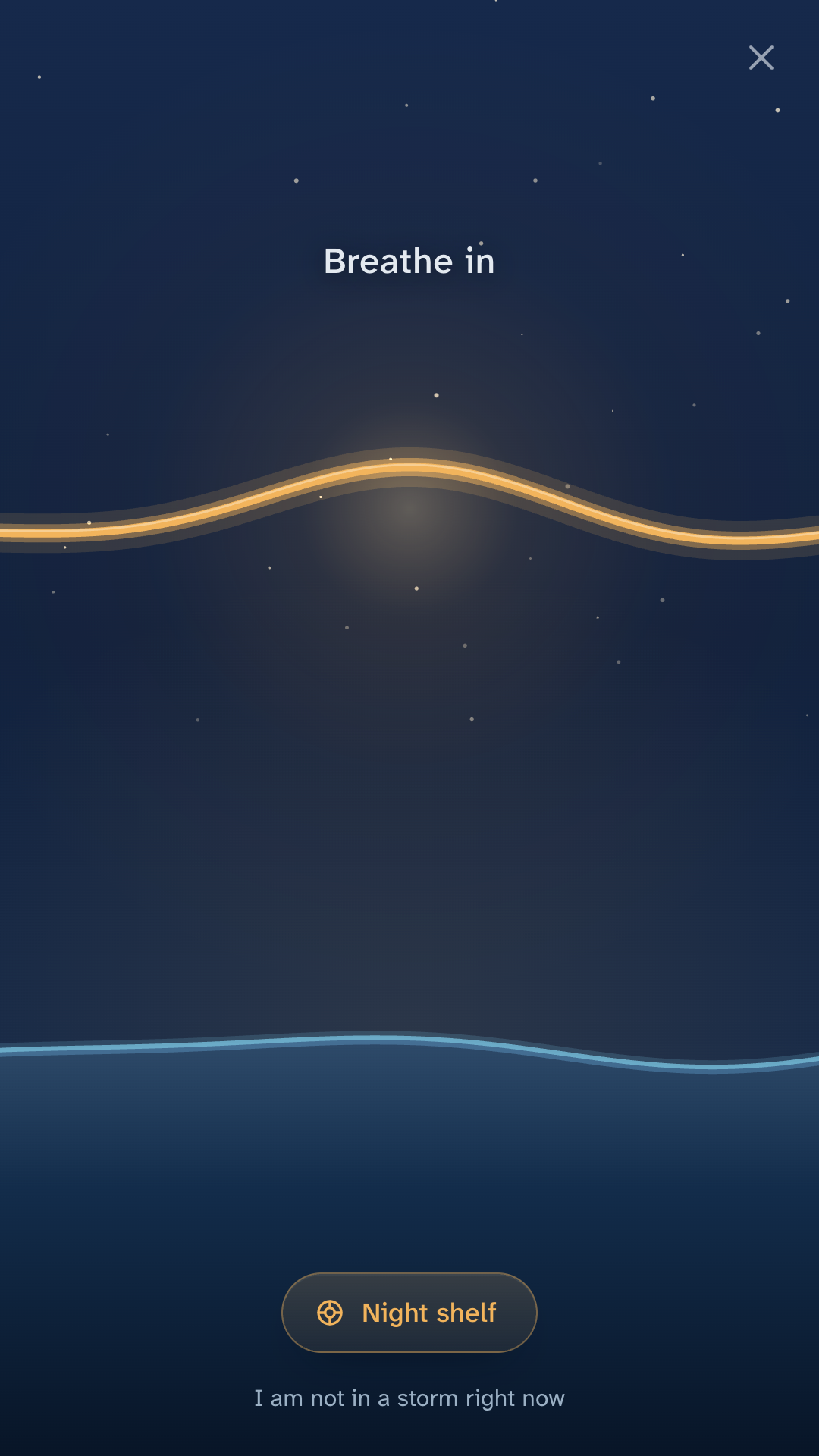 The session screen: a warm wave of light riding over cool water under a field of stars, with the words Breathe in.